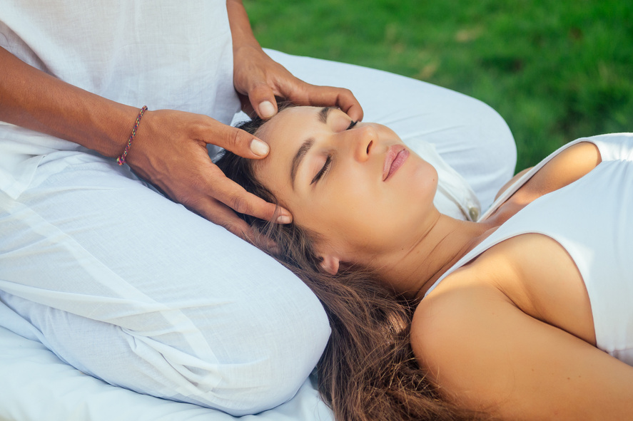 outdoor tropics beach spa centre.pregnant woman getting relax massage in tropical garden